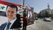 Men hang the national flag next to posters of President Bashar Assad, a candidate for the presidential election, in the Syrian capital Damascus. Men hang the national flag next to posters of President Bashar Assad, a candidate for the presidential election, in the Syrian capital Damascus.