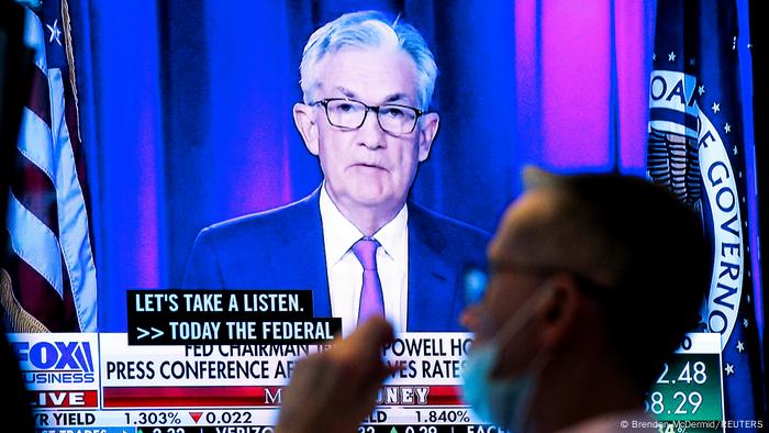 A photo of Jerome Powell on a TV screen with a scholarship staring at him A photo of Jerome Powell on a TV screen with a scholarship staring at him