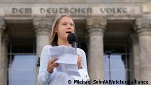Swedish climate activist Greta Thunberg holds a speech during a Fridays for Future global climate strike in front of a parliament building in Berlin, Germany, Friday, Sept. 24, 2021. (AP Photo/Michael Sohn)