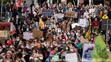 People gather for a Fridays for Future global climate strike in Berlin, Germany, Friday, Sept. 24, 2021. (AP Photo/Markus Schreiber)