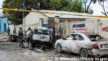 Security officers patrol on the site of a car-bomb attack in Mogadishu, on September 25, 2021. (Photo by STRINGER / AFP) (Photo by STRINGER/AFP via Getty Images)