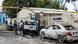 Security officers patrol on the site of a car-bomb attack in Mogadishu Security officers patrol on the site of a car-bomb attack in Mogadishu