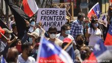 Residents take part in a march against illegal migration, in Iquique, Chile, Saturday, Sept. 25, 2021. Most of the migrants entering the country illegally are Venezuelans who enter from the north. (AP Photo/Ignacio Munoz)