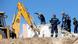 Firefighters look for people in the rubble of a demolished church following an earthquake, in Arkalochori on the island of Crete Firefighters look for people in the rubble of a demolished church following an earthquake, in Arkalochori on the island of Crete