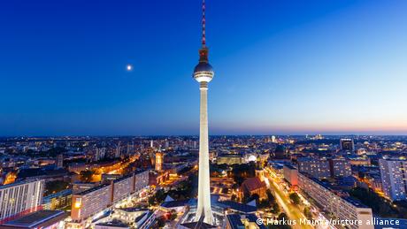 Berlin's Fernsehturm (TV tower) and Alexanderplatz at night.