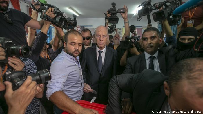 President Kais Saied surrounded by media as he votes in 2019. 