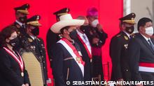 Peru's President Pedro Castillo (C) attends a ceremony for Armed Forces Day alongside Supreme Court President Elvia Barrios Alvarado (L) and Defense Minister Walter Ayala Gonzales, in Lima, Peru September 24, 2021. REUTERS/Sebastian Castaneda