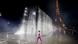 Yves Saint Laurent models on the runway at Paris Fashion Week 2021 with the Eiffel Tower and a water fountain in the background Yves Saint Laurent models on the runway at Paris Fashion Week 2021 with the Eiffel Tower and a water fountain in the background