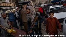 Taliban fighters patrol a market in Kabul's Old City, Afghanistan, Tuesday, Sept. 14, 2021. (AP Photo/Bernat Armangue)