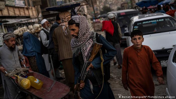 Taliban fighters patrol the streets