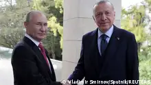 Russian President Vladimir Putin shakes hands with Turkish President Tayyip Erdogan during a meeting in Sochi, Russia September 29, 2021. Sputnik/Vladimir Smirnov/Pool via REUTERS ATTENTION EDITORS - THIS IMAGE WAS PROVIDED BY A THIRD PARTY.