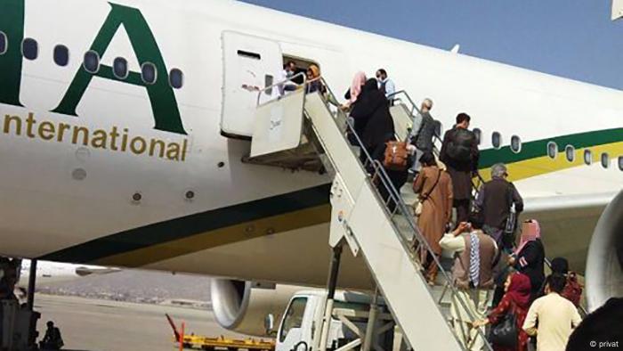 People boarding a plane