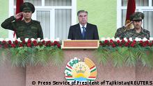 Tajik President Emomali Rakhmon and high-ranking military officials attend a parade near the border with Afghanistan in the town of Khorog (Khorugh), Tajikistan September 30, 2021. Press Service of President of Tajikistan/Handout via REUTERS ATTENTION EDITORS - THIS IMAGE WAS PROVIDED BY A THIRD PARTY. NO RESALES. NO ARCHIVES. MANDATORY CREDIT.