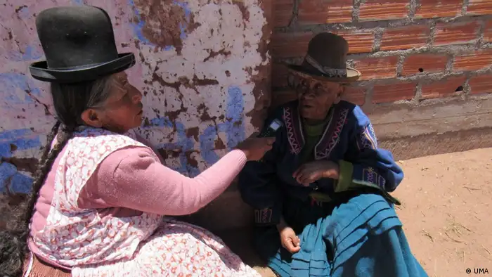 A woman conducts an interview on the street in Bolivia