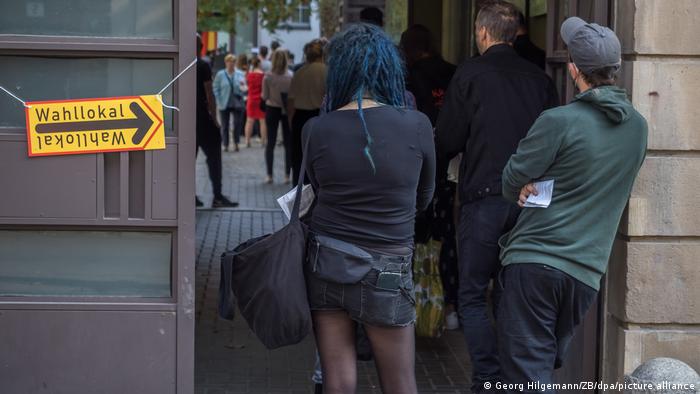 Berliners standing in line waiting to vote