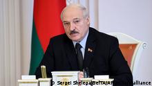 Belarus President Alexander Lukashenko speaks during a meeting with officials in Minsk, Belarus, Friday, Oct. 1, 2021. (Sergei Shelega/BelTA Pool Photo via AP)