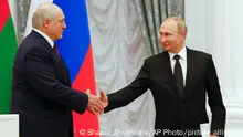 Russian President Vladimir Putin, right, and Belarusian President Alexander Lukashenko shake hands before a joint press conference in the Kremlin in Moscow, Russia, Thursday, Sept. 09, 2021. (Shamil Zhumatov/Pool Photo via AP)