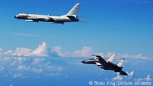 NANJING, Sept. 25, 2016 (Xinhua) -- A Su-30 fighter and an H-6K bomber of the Chinese Air Force take part in a drill, Sept. 25, 2016. The Chinese Air Force on Sunday sent more than 40 aircraft of various types to the West Pacific, via the Miyako Strait, for a routine drill on the high seas, a spokesperson said. Bombers and fighters of the PLA Air Force also conducted routine patrol in the East China Sea Air Defense Identification Zone (ADIZ). (Xinhua/Shao Jing) (zkr