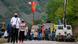 Ethnic Serbs walk through barricades near the northern Kosovo border crossing of Jarinje on the ninth day of protest on Tuesday, Sept. 28, 2021 Ethnic Serbs walk through barricades near the northern Kosovo border crossing of Jarinje on the ninth day of protest on Tuesday, Sept. 28, 2021