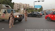 Libyan soldiers man a checkpoint southeast of the capital Tripoli, on September 4, 2021, after clashes near the Tekbali barracks, the headquarters of 444 Brigade. - Two Libyan army units used heavy artillery in an exchange of fire overnight centring on a barracks in a densely populated area of southeast Tripoli, the military command said. (Photo by Mahmud TURKIA / AFP) (Photo by MAHMUD TURKIA/AFP via Getty Images)