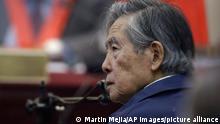 Former President Alberto Fujimori listens to a question during his testimony in a courtroom at a military base in Callao, Peru, Thursday, March 15, 2018. Fujimori testified at the trial charging his former intelligence chief of ordering the kidnapping of Peruvian journalist Gustavo Gorriti in 1992. (AP Photo/Martin Mejia)