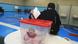 A women puts her ballot in a box that reads "Shura Council elections" A women puts her ballot in a box that reads "Shura Council elections"