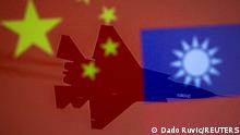 FILE PHOTO: Chinese and Taiwanese national flags are displayed alongside a military airplane in this illustration taken April 9, 2021. REUTERS/Dado Ruvic/Illustration/File Photo