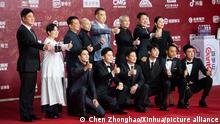 (210920) -- BEIJING, Sept. 20, 2021 (Xinhua) -- Cast members of the film the Battle at Lake Changjin pose for a group photo on the red carpet for the 11th Beijing International Film Festival in Beijing, capital of China, Sept. 20, 2021. (Xinhua/Chen Zhonghao)