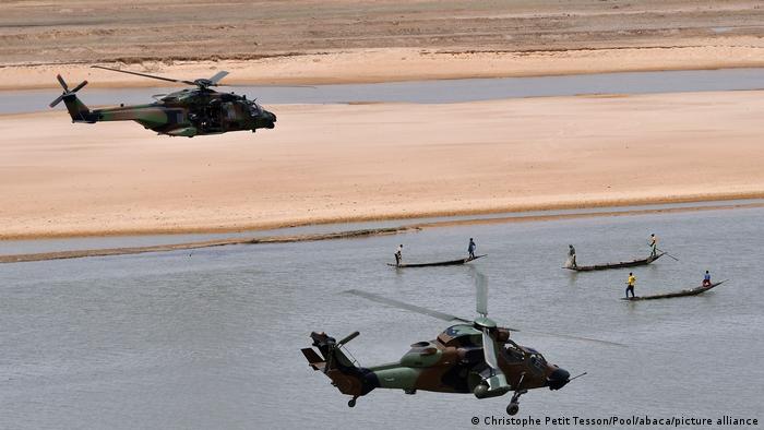 French President Emmanuel Macron (up) flies over Gao inside a military helicopter during a visit to France's Barkhane counter-terrorism operation in Africa's Sahel region, northern Mali,