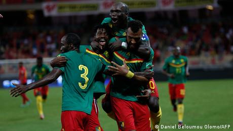 Cameroon forward Eric Maxim Choupo-Moting is congratulated after scoring a goal