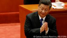 Chinese President Xi Jinping applauds at a meeting commemorating the 110th anniversary of Xinhai Revolution at the Great Hall of the People in Beijing, China October 9, 2021. REUTERS/Carlos Garcia Rawlins