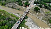 Aerial view of the Francisco de Paula Santander International Bridge linking Cucuta, Colombia, and Urena, Tachira state, Venezuela, on October 8, 2021, after containers placed as barricades in 2019 were removed. - The containers were placed as barricades two years ago as part of a political dispute between Venezuelan President Nicolas Maduro and opposition leader Juan Guiadoto to block the border crossing between the two countries. The migration was only allowed for humanitarian or educational reasons. (Photo by Edinson ESTUPINAN / AFP) (Photo by EDINSON ESTUPINAN/AFP via Getty Images)
