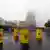 Yellow drums meant to signify nuclear drums are stacked at a nuclear facility in Lingen