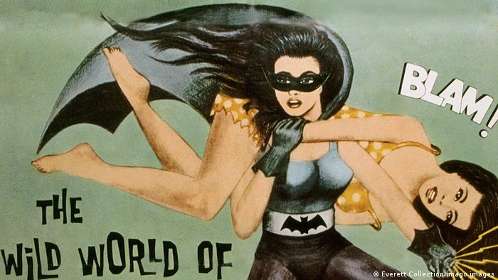 На плакате Бэтвумен несет на плечах женщину