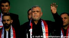 Hadi al-Amiri, center, commander in the Popular Mobilization Forces, and leader of a political movement called Al-Fateh Alliance speaks to his followers during his political block campaign rally before the parliamentary elections in Baghdad, Iraq, Tuesday, Oct. 5, 2021. (AP Photo/Hadi Mizban)