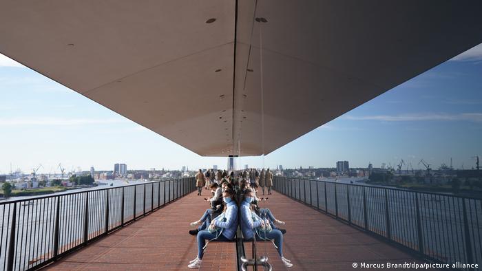 Visitors wearing masks on the Elbphilharmonie viewing platform.