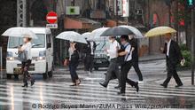 October 1, 2021, Tokyo, Japan: Pedestrians holding umbrellas walk under a heavy rain in downtown Tokyo. The heavy rain and strong winds affected public transports in prefectures near the capital, and the flights were temporarily suspended in Tokyo's Haneda airport. (Credit Image: Â© Rodrigo Reyes Marin/ZUMA Press Wire