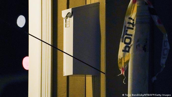 An arrow is left in a wall at the scene where a man armed with bow killed several people before he was arrested by police in Kongsberg, Norway
