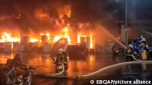 In this image taken from video by Taiwan's EBC, firefighters battle a blaze at a building in Kaohsiung, in southern Taiwan on Thursday, Oct. 14, 2021. The fire engulfed a 13-story building overnight in southern Taiwan, the island's semi-official Central News Agency reported Thursday. (EBC via AP )