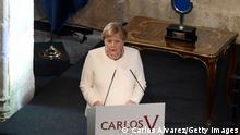 CUACOS DE YUSTE, SPAIN - OCTOBER 14: Angela Merkel gives a speech during the 'Carlos V' Award ceremony at Yuste Monastery where Angela Merkel, chancellor of the Federal republic of Germany is awarded today for all her career, on October 14, 2021 in Cuacos de Yuste, Spain. (Photo by Carlos Alvarez/Getty Images)