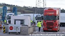 LARNE, NORTHERN IRELAND - JANUARY 01: Customs officials check the first freight trucks as they disembark from the European Causeway ferry at the port of Larne on January 1, 2021 in Larne, United Kingdom. January 1st 2021 marks the first day of the UK's future outside the European Union. Larne harbour is one of three point of entry locations situated in Northern Ireland along with Belfast and Warrenpoint. (Photo by Charles McQuillan/Getty Images)