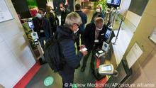 Employees have their certification checked as Italy's new “Green Pass” vaccination requirement for employees to enter their offices became mandatory, at the Trenitalia, Italian train company offices, in Rome, Friday, Oct. 15, 2021. From Friday, certification is required for public and private workplaces. Both employees and employers risk fines if they don’t comply. Public sector workers can be suspended if they show up five times without a Green Pass. The pass is already required in Italy to enter museums, theaters, gyms and indoor restaurants, as well as to take long-distance trains and buses or domestic flights. The passes show that a person has had least one COVID-19 vaccine dose, or recovered from the virus in the last six months, or has tested negative in the last 48 hours. (AP Photo/Andrew Medichini)