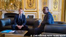 French President Emmanuel Macron (L) and Guinea-Bissau's President Umaro Sissoco Embalo pose prior to their meeting at the Elysee palace in Paris, on October 15, 2021. (Photo by Christophe PETIT TESSON / POOL / AFP)