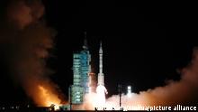 (211016) -- JIUQUAN, Oct. 16, 2021 (Xinhua) -- The crewed spaceship Shenzhou-13, atop a Long March-2F carrier rocket, is launched from the Jiuquan Satellite Launch Center in northwest China's Gobi Desert, Oct. 16, 2021. (Xinhua/Li Gang)