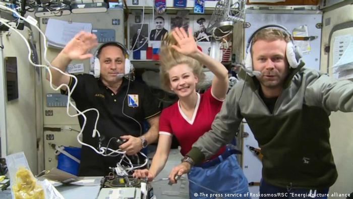 In this handout video grab released by the Russian Space Agency Roscosmos, from left, cosmonaut Anton Shkaplerov, actress Yulia Peresild and film director Klim Shipenko are pictured during the 66th Expedition to the International Space Station