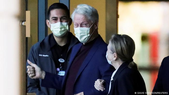 Former President Bill Clinton walks out of hospital with Hillary Clinton