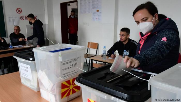 Voters hand in their ballots in Macedonia's local elections