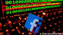 FILE PHOTO: A 3D printed Facebook logo is pictured on a keyboard in front of binary code in this illustration taken September 24, 2021. REUTERS/Dado Ruvic/Illustration/File Photo