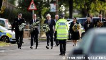 Britain's Labour Party leader Keir Starmer, Prime Minister Boris Johnson and Home Secretary Priti Patel hold flowers as they arrive at the scene where British MP David Amess was stabbed to death during a meeting with constituents at the Belfairs Methodist Church, in Leigh-on-Sea, Britain, October 16, 2021. REUTERS/Peter Nicholls