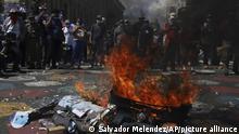 An effigy of President Nayib Bukele is set on fire by demonstrators during an anti-government protest in San Salvador, El Salvador, Sunday, Oct. 17, 2021. (AP Photo/Salvador Melendez)